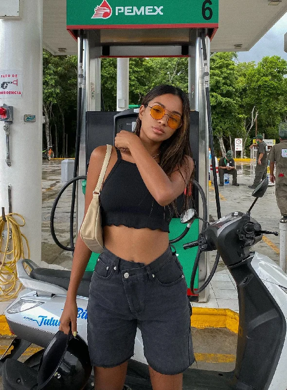 Pleated trousers – Trousers with folds or pleats in the front, often adding volume or texture to the garment.Ripped shorts – Denim or other fabric shorts with intentional tears or distressing for a rugged, trendy look.Eliana Shorts Black